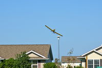 N2378Q - Working the field just west of my neighborhood.  Now watching from my front yard in North Liberty Iowa