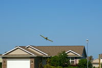 N2378Q - Working the field just west of my neighborhood.  Now watching from my front yard in North Liberty Iowa.
