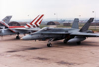 188767 @ EGDM - CF-18A Hornet, callsign Embassy Hornet Charlie, of 409 Squadron Canadian Armed Forces on the flight-line at the 1990 Boscombe Down Battle of Britain 50th Anniversary Airshow. - by Peter Nicholson