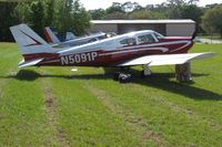 N5091P @ ZPH - Tied down in the grass at Zephyrhills, Florida - by Bob Simmermon