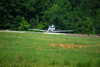 N8168W @ KUZA - SR22 taxiing to runway 20 with the door open - by Connor Shepard