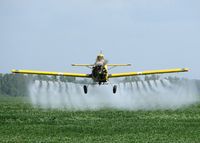 N91968 - Dusting a field about 10 miles north of Natchitoches, Louisiana.
