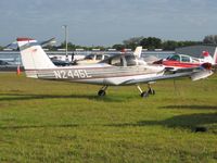 N2445L @ ZPH - Tied down in the grass at Zephyrhills, Florida during Sun N Fun week. - by Bob Simmermon