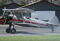 N65124 @ SZP - 1943 Boeing Stearman A75N1 'Spirit of OPEC', P&W R-985 Wasp Jr. (by Jacobs) 450 Hp upgrade, square wingtips, Restr. Exper. class, 180 deg. turn & takeoff roll thru smoke practice, Rwy 22 - by Doug Robertson