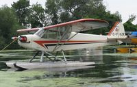 C-FKZK @ 96WI - Piper J3C-65 Cub moored at AirVenture 2010. - by Kreg Anderson