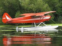 C-FRGL @ 96WI - Piper PA-18-150 Super Cub moored at AirVenture 2010. - by Kreg Anderson