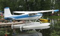 N180PT @ 96WI - Cessna 180 Skywagon at the loading docks at AirVenture 2010. - by Kreg Anderson