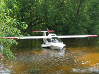 N997BA @ 96WI - Icon A5 beached at a shady beach at Vette/Blust Seaplane Base with kids playing in the water beside it. - by Kreg Anderson