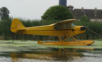 N42709 @ 96WI - Piper J3C-65 Cub moored at AirVenture 2010. - by Kreg Anderson