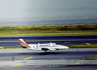 N99100 @ LGA - Beech 99 of Air New England taxying to the terminal at La Guardia in the Summer of 1976. - by Peter Nicholson