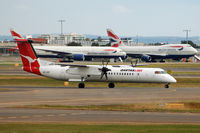 VH-QOE @ YSSY - At Sydney - by Micha Lueck