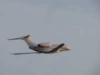 N792XJ @ KOSH - Leaving Oshkosh into setting sun - by steveowen