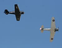 N934JT @ TIX - SNJ-4 formation - by Florida Metal