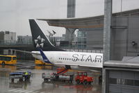 LN-RRL @ ENGM - Scandinavian Airlines on Gate A39....LN-RRL soon ready for departure to Milano/Malpensa (MXP) from Oslo/Gardermoen (OSL)...Rainy day!:(...The Control Tower in the background:) - by Samuel Gombos
