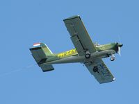 PH-ZZY - Taken by the coast near Hayle. The plane was pulling a banner for Flambards Theme Park Helston. - by John Roberts