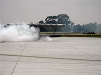 N30136 @ NTD - 1980 Waco UPF-7, P&W R-985 Wasp Jr. 450 Hp upgrade, taxi out of 360 degree smoke turn - by Doug Robertson