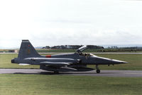 K-3014 @ EGQS - A friendly wave from the pilot of this 314 Squadron NF-5A as he waited for clearance to join the active runway at RAF Lossiemouth in May 1990. - by Peter Nicholson