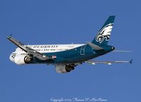 N709UW @ KPHL - US Airways logojet displaying Philadelphia Eagles livery, climbing out from 27L at PHL. - by Tom McManus