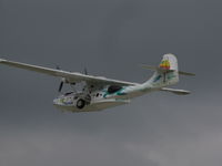 N222FT @ KOSH - Off into stormy skies at EAA2010 airshow - by steveowen