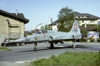 J-3002 @ LSMJ - A common scene during the Wiederholungskurs at Turtmann: while the Tigers cross the main street of the Turtmann village the paintwork in the background goes on as normal. - by Joop de Groot