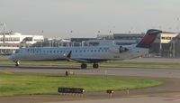N928XJ @ KMSP - Delta Connection CRJ beginning its takeoff roll at MSP. - by Kreg Anderson