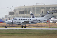 N450CK @ KAUS - Raytheon/Beech departs 17L. - by Darryl Roach