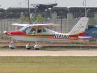 N141AG @ KAUS - Cessna look-a-like lands 17L. - by Darryl Roach