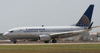 N15710 @ KAUS - COA B737 departs 17L. Probably one of the last times I'll get to shoot the COA livery. - by Darryl Roach