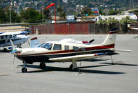 N199HP @ KSQL - Flying Bull Aviation (Doral, FL) 1999 Piper PA-32R-301 on transient ramp at KSQL - by Steve Nation