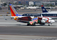 N918WN @ KPHX - Southwest B-737 displaying Illinois One logo taxiing to the gate at PHX. - by T.P. McManus