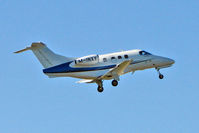 M-INXY @ EGNX - Based 2009 Embrear EMB500 Phenom-100, c/n: 50000024 climbs away from East Midlands - by Terry Fletcher