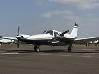 N38768 @ KTOA - Piper Seneca II at a TOA tie down spot.