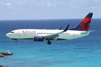 N304DQ @ TNCM - Boeing 737-732, c/n: 29683 - by Trevor Toone