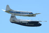 SE-BKH @ ESOW - Pembroke SE-BKH flying with Riley Turbo Skyliner N415SA over Västerås Hässlö airport in Sweden during the 2010 Roll-out air show.