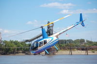 N7142R @ MO7 - Sightseeing copter taking off from a barge moored on the Mississippi River at the base of Gateway Arch in downtown St. Louis. - by Don Jones