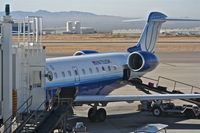 N752SK @ KTUS - SkyWest Bombardier CL-600-2C10, N752SK loading up for a return trip to KLAX. - by Mark Kalfas