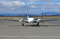 N873AN @ KAPC - IFTA Beech 58 taxis in to Bridgeport FS ramp with Napa River bridge in background - 1st time I've seen it in down position! - by Steve Nation