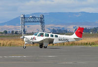 N8295L @ KAPC - Japan Airlines 1992 Beech A36 with Napa River RR Bridge in background taxis for training flight - by Steve Nation