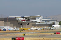 N211TD @ KCCR - Locally-based 2000 Cessna 172S climbs out from RWY19L at Buchanan Field with APEX Aviation hangar in background - by Steve Nation