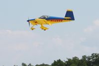 N129RV @ OSH - Landing at Oshkosh, Wisconsin during Airventure 2010 - by Bob Simmermon