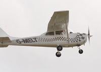 G-MELT @ EGHO - G-MELT practising short take-offs and landings at Thruxton airfield, seen from the Hampshire Air Ambulance helipad. - by David Quick