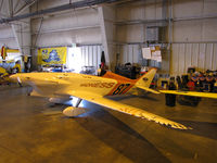 N687RB @ KRTS - Race #87 1988 Boyd Robert C BOYD GR-7 PANTHER Madness showing yellow and orange side for Formula I Class race @ 2009 Reno Air Races - in hangar - by Steve Nation
