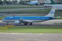 PH-EZP @ EHAM - KLM cityhopper taxiing for take off with a Jade Cargo B747 rolling behind