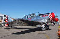 N4802E @ KRTS - Polished metal Race #66 AT-6 with Gunslinger nose art in T-6 Class pit area @ 2009 Reno Air Races - by Steve Nation