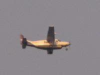 N703FX @ KOSH - Taken when flying overhead into the setting sun KOSH