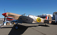 N94466 @ KRTS - Race #18 is a shark mouth P-40E (as NX94466) with desert camo and SU-E code for Unlimited Class races in pit area @ 2009 Reno Air Races - by Steve Nation