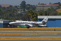 N924JE @ KCCR - AEEH-DMP LLC (DMP logo on tail) 2001 Cessna 560XL departing Buchanan Field/Concord, CA (KCCR) for Springfield Regional Airport, MO (KSGF) - main gear retracting - by Steve Nation