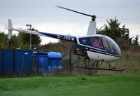 G-JHEW @ EGTB - Robinson R22 Beta at Wycombe Air Park - by moxy