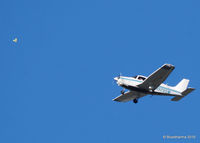 N9285M - 1985 Piper PA-28-161 C/N 28-8616043 passes a balloon. - by Bluedharma