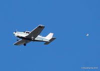 N9285M - 1985 Piper PA-28-161 C/N 28-8616043 passes a balloon. - by Bluedharma